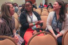 Conference participants in small group discussion during the concurrent sessions.