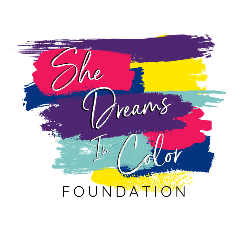 colorful paint strokes make up the background of the She Dreams In Color Foundation logo